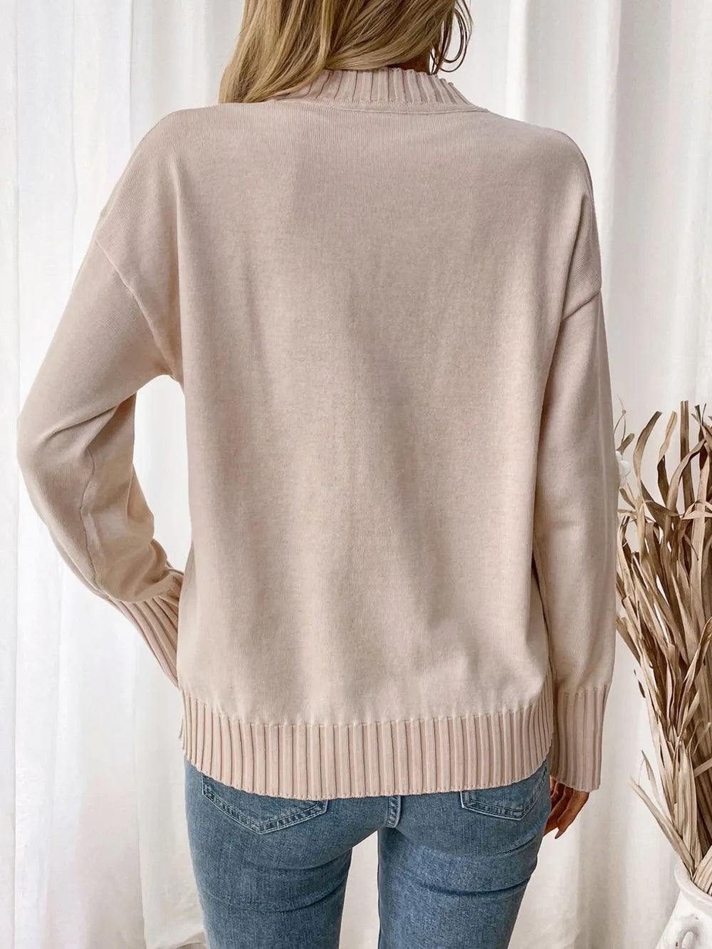 Pull à manches longues et col rond avec motif fleuri